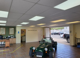 An image showing a car show room with some newly fitted LED ceiling lights