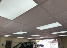 An image showing a car show room with some newly fitted LED ceiling lights
