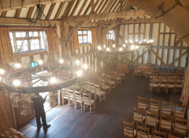 An image showing a large room with newly fitted decorative hanging ceiling lights