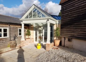 An images showing a public doorway with newly fitted outdoor lights