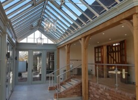 An image showing a large room with newly fitted decorative hanging ceiling lights