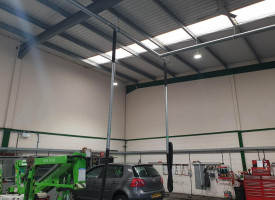 An image showing a car show room with some newly fitted LED ceiling lights