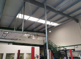An image showing a car show room with some newly fitted LED ceiling lights